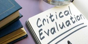 A magnifying glass over the words critical evaluation to highlight the importance of a critical analysis of an article